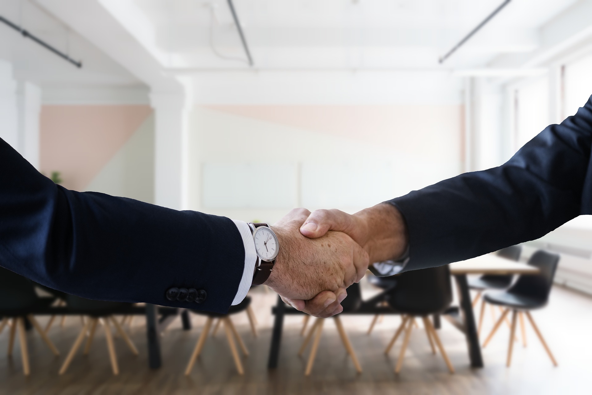A stock image of a handshake to accompany article on why use a PEO