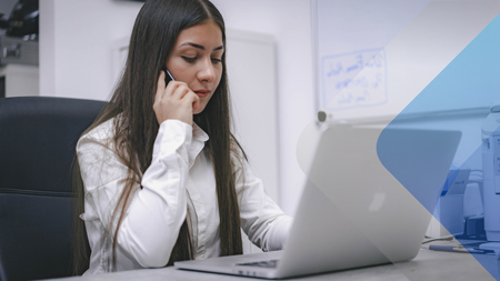 Stock image of a woman making a phone call representing someone working for a headhunters in Latin America.