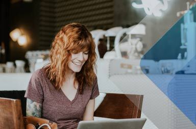 Woman at computer to illustrate article on digital networking. Photo by Brooke Cagle on Unsplash