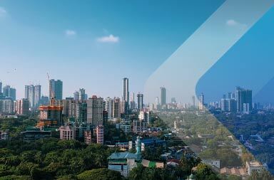 A linha do horizonte de Mumbai para um artigo sobre contratação internacional. Por Hardik Joshi em Unsplash