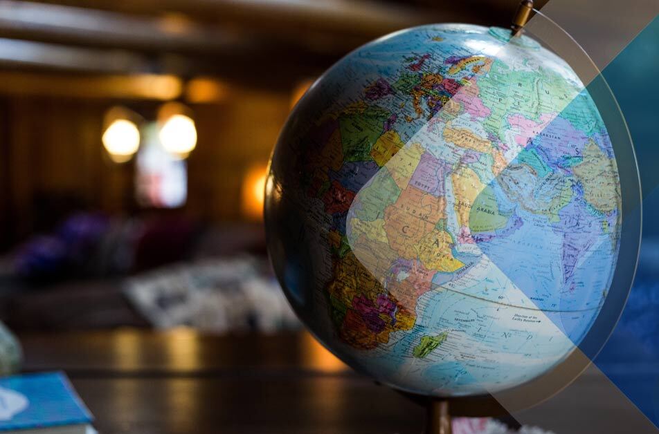 Globe on desk to show hiring internationally. By Kyle Glenn on Unsplash