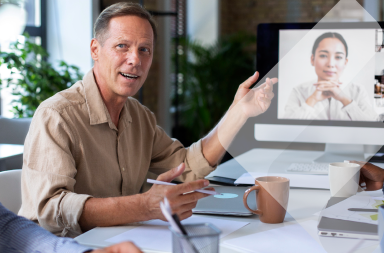 Men working remotely on a computer to exemplify the results of hiring remote foreign employees.